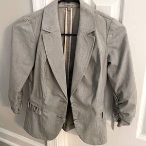 Peplum style blazer.